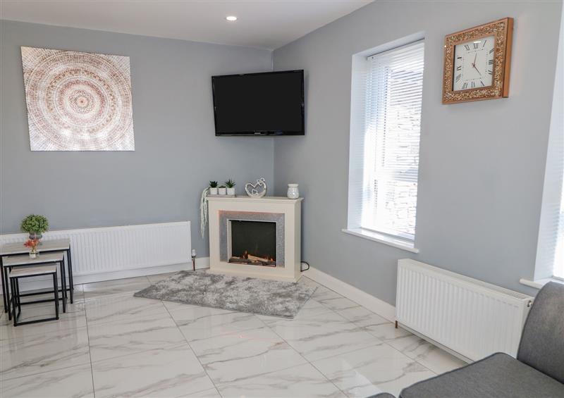 Relax in the living area at SJs Cottage, Castlerock