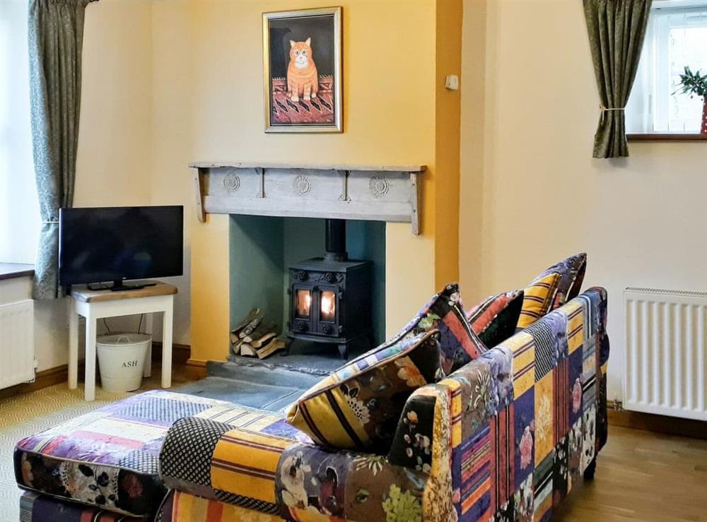 Warm and welcoming open plan living area at Skelmorlie Cottage in Portinscale, near Keswick, Cumbria