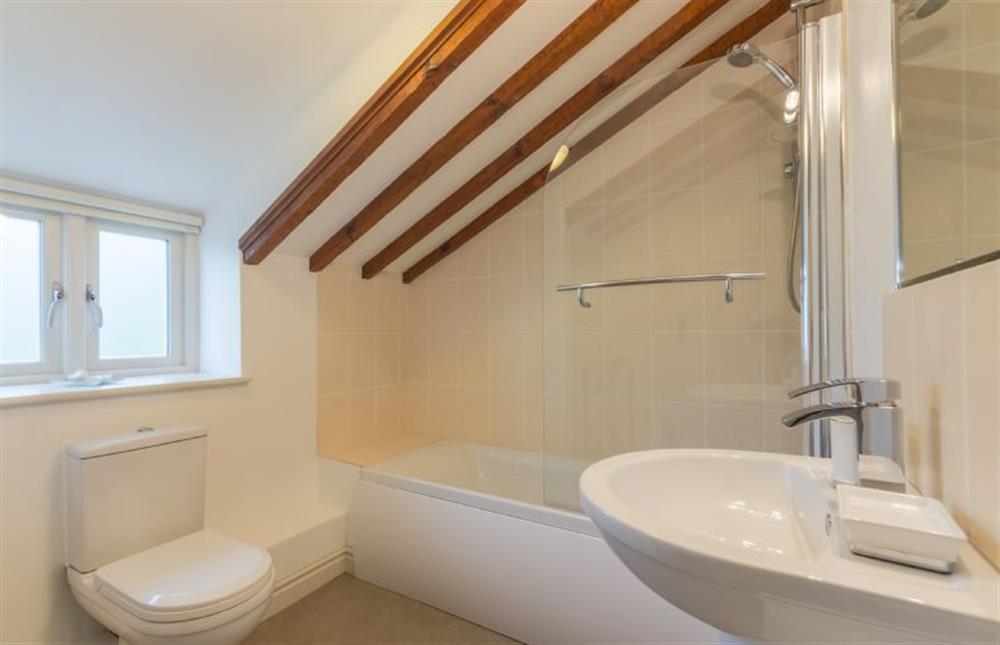First floor: Bath with shower over at Skimming Stones, North Creake near Fakenham