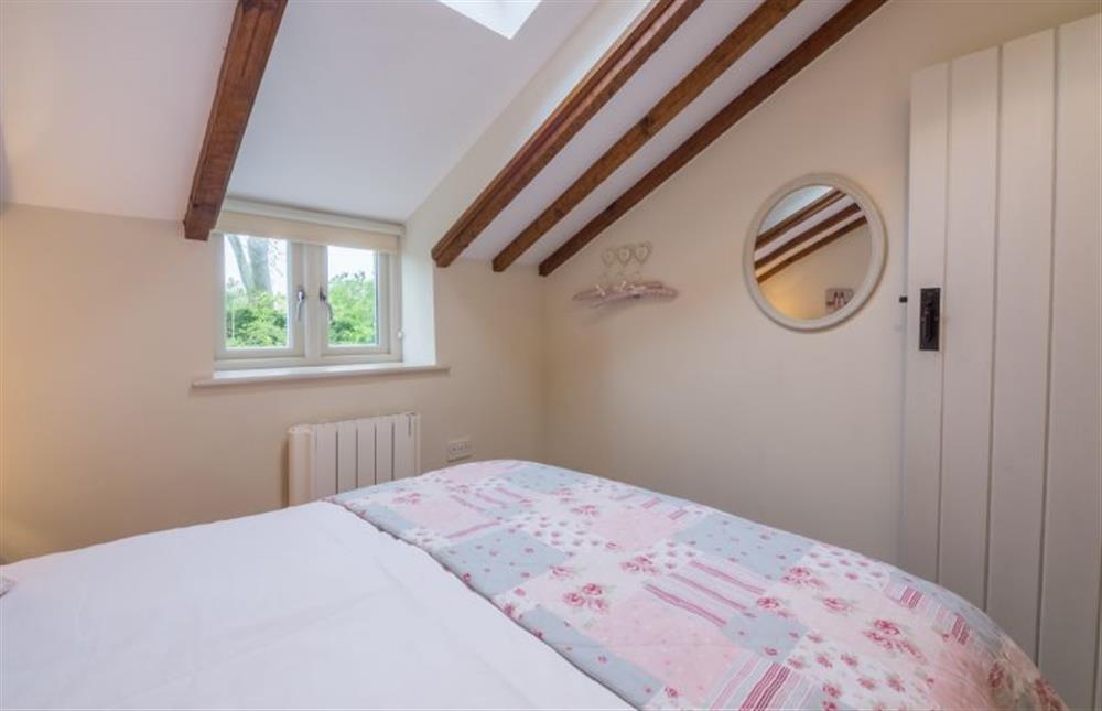 First floor: Bedroom two, double bed (photo 2) at Skimming Stones, North Creake near Fakenham