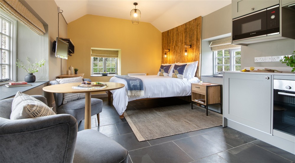The open-plan living space at Skipper's Cabin in Padstow, Cornwall