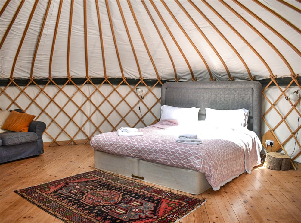 Double bedroom at Skylark Yurt in Beaminster, Dorset
