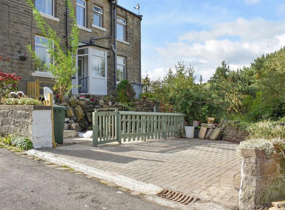 Outdoor area with private parking space at Slant End Cottage in Linthwaite, Holmfirth, West Yorkshire