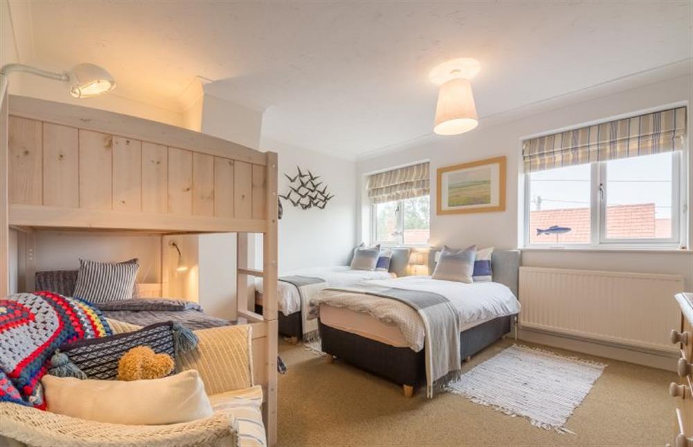 First floor:  Bedroom two has twin beds and bunk bed at Sleepy Gull, Old Hunstanton