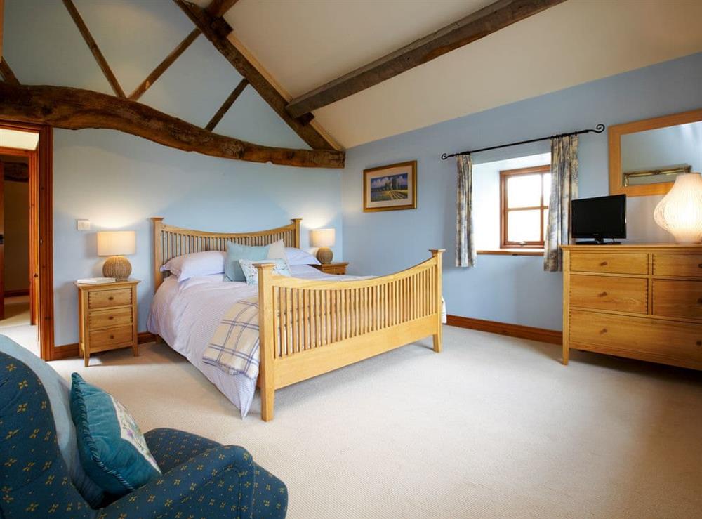 Tranquil bedroom with kingsize bed at Rowan Cottage, 