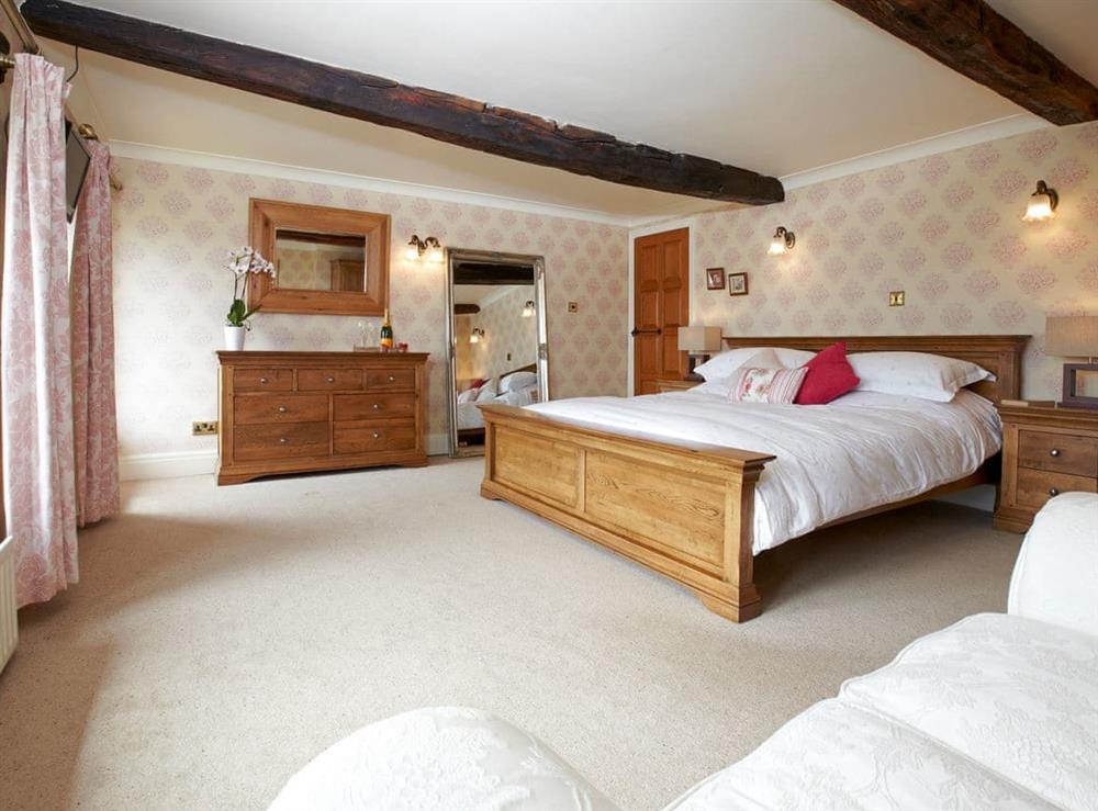 Bedroom with kingsize bed at The Farmhouse, 