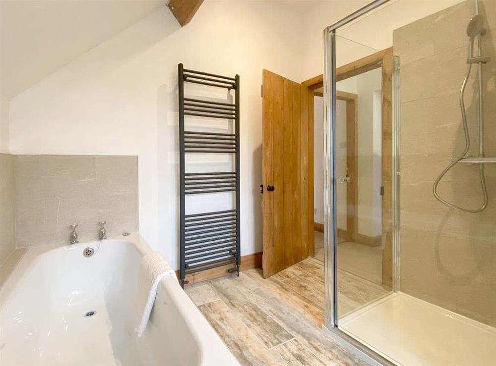 Family bathroom with bath and separate shower cubicle at Smardale Cottages in Kirkby Stephen, Cumbria