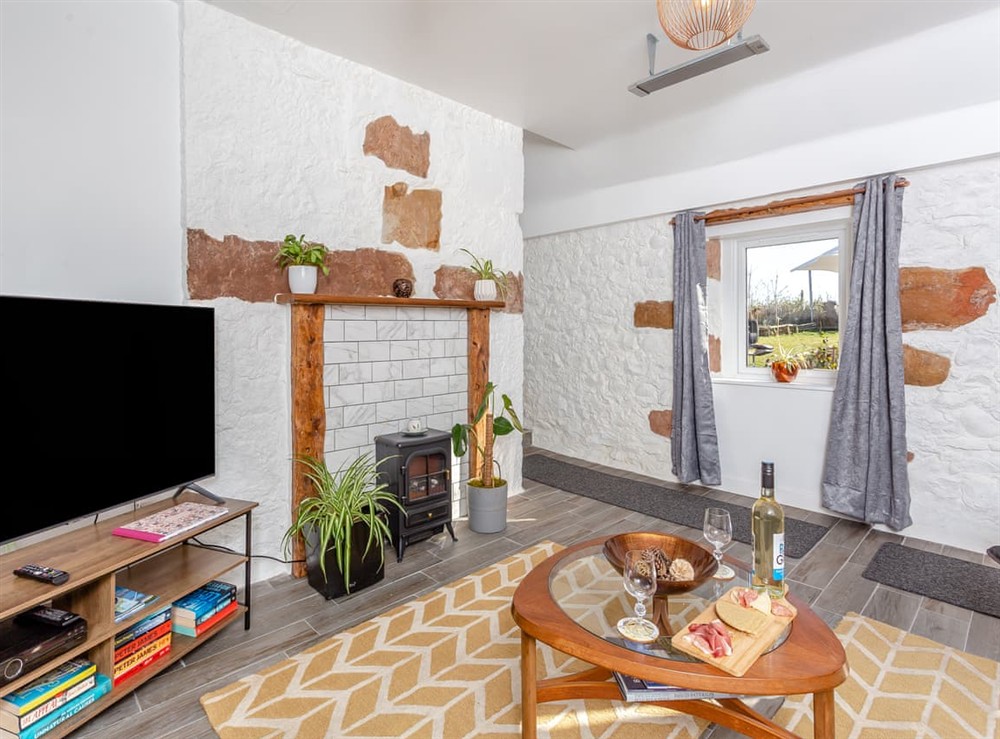 Living area (photo 2) at Smiddy Cottage in Portmahomack, Ross-Shire