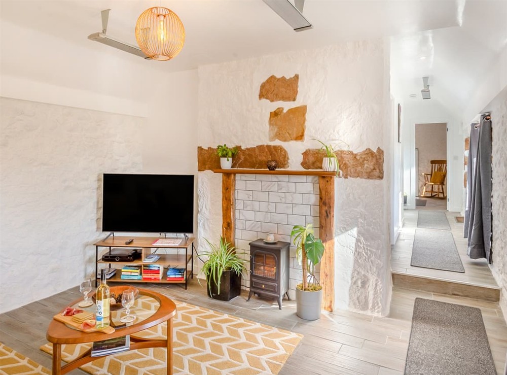 Living area (photo 4) at Smiddy Cottage in Portmahomack, Ross-Shire