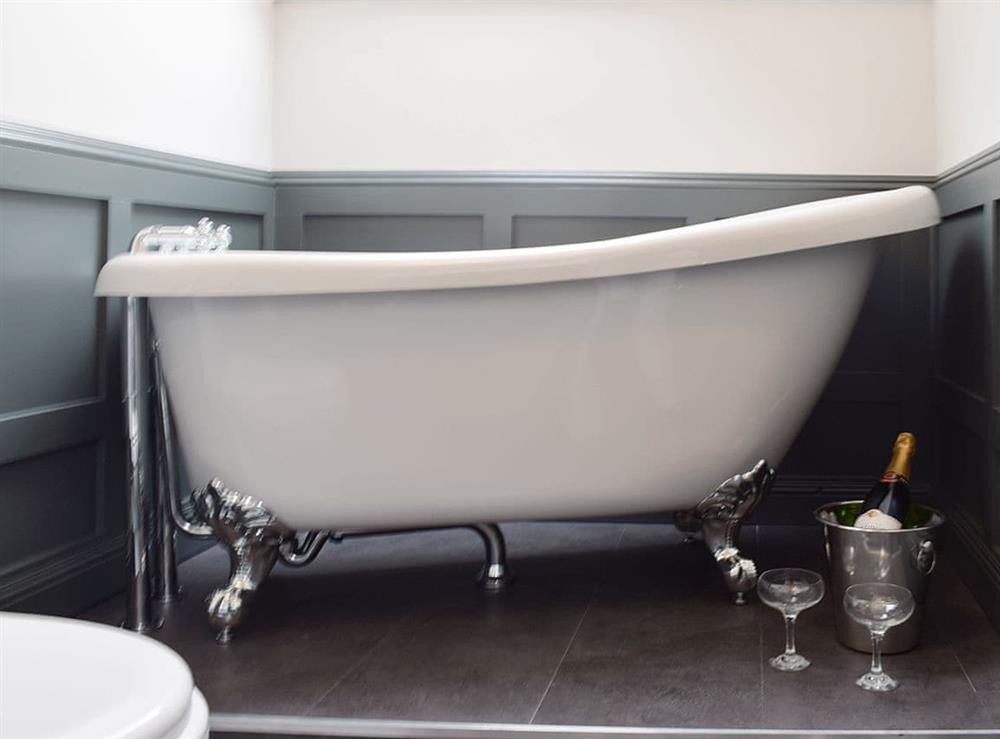 Roll-top free standing bath in bathroom at Smiddy Cottage in Weem, near Aberfeldy, Perthshire