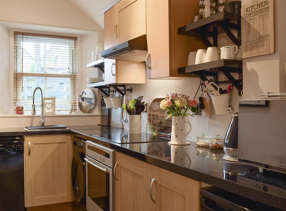Well-equipped fitted kitchen at Smiddy Cottage in Weem, near Aberfeldy, Perthshire
