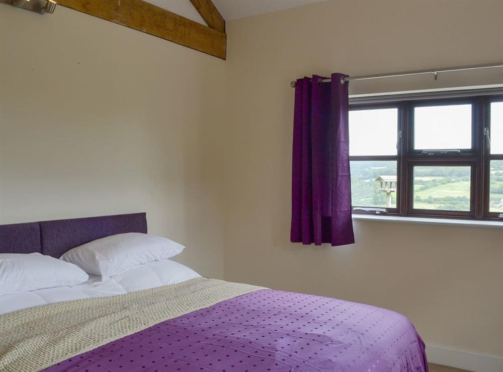 Double bedroom with zip and link super kingsize bed (can be twin beds on request) (photo 2) at The Barn, 