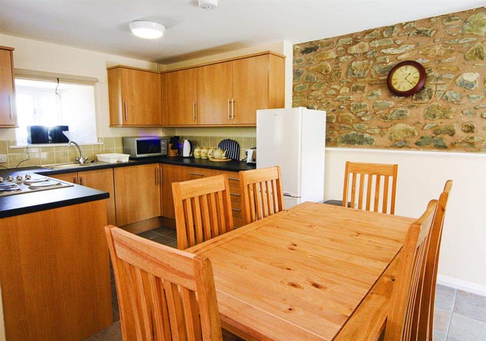 Smithy Barn dining and kitchen area at Smithy Barn in Abergele, Clwyd