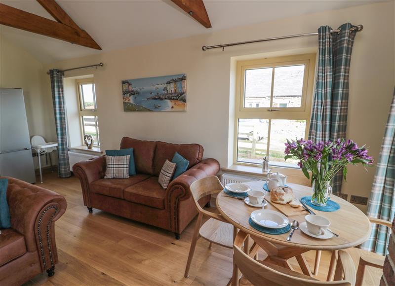 Enjoy the living room at Smithy Cottage, Embleton