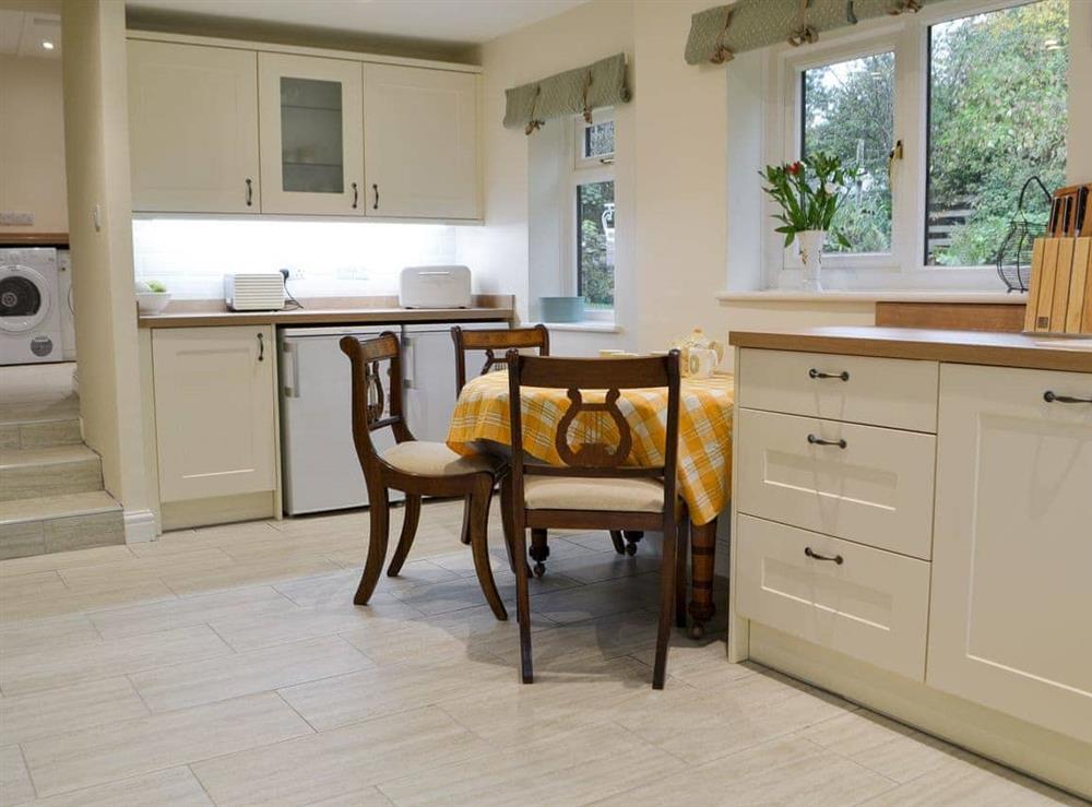 Kitchen with dining area (photo 2) at Smithy House in Bampton Grange, near Pooley Bridge, Cumbria