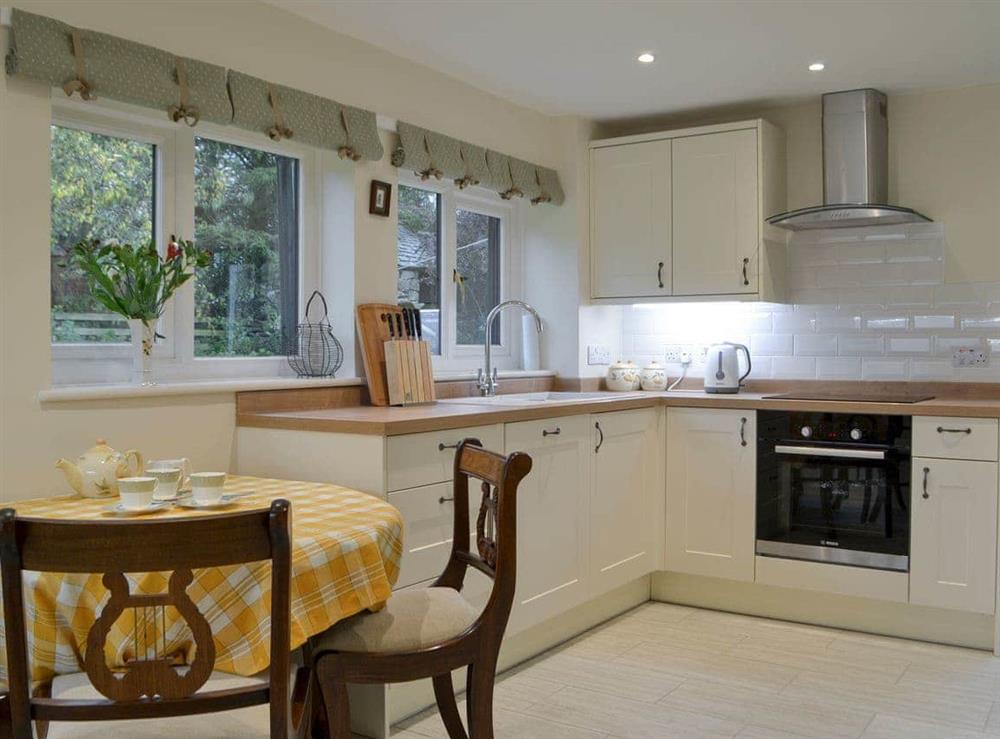 Kitchen with dining area at Smithy House in Bampton Grange, near Pooley Bridge, Cumbria