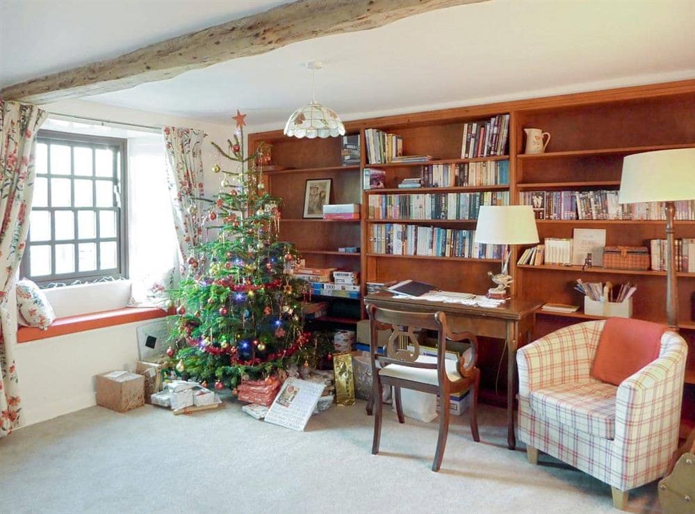 Snug area with seasonal decorations at Smithy House in Bampton Grange, near Pooley Bridge, Cumbria
