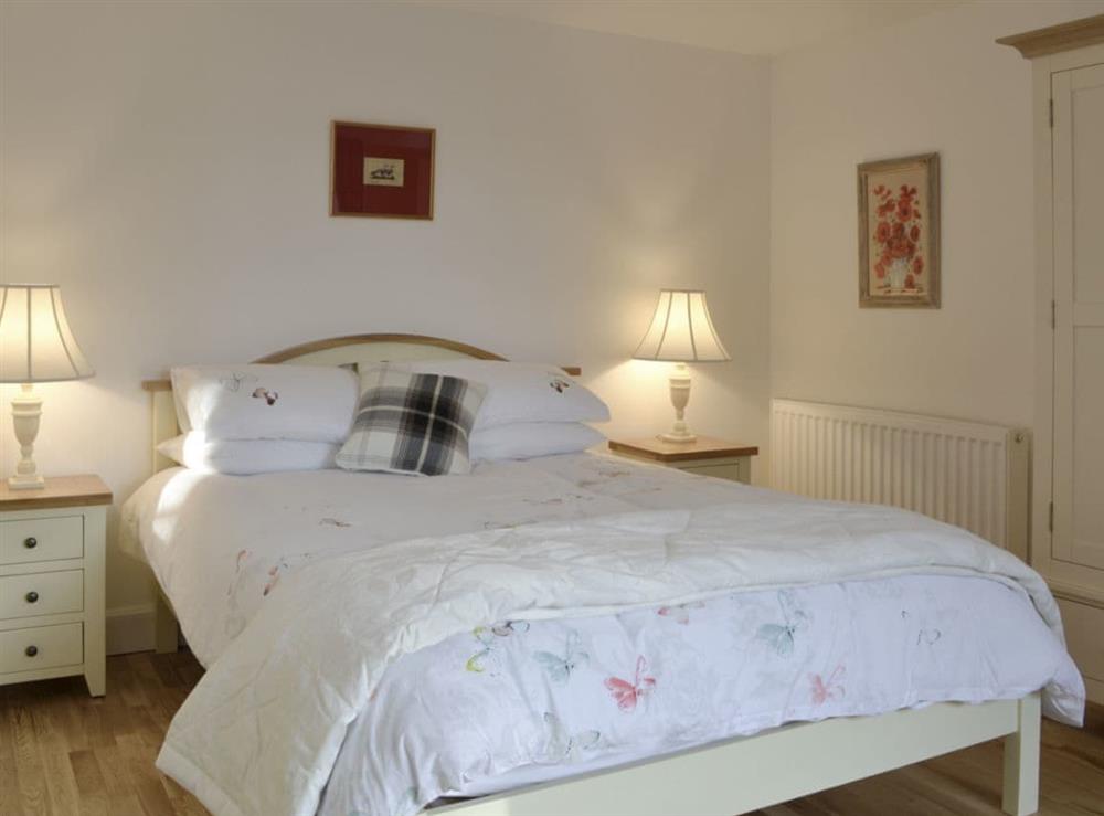 Comfortable master bedroom at Smithy House in Guthrie, near Forfar, Angus