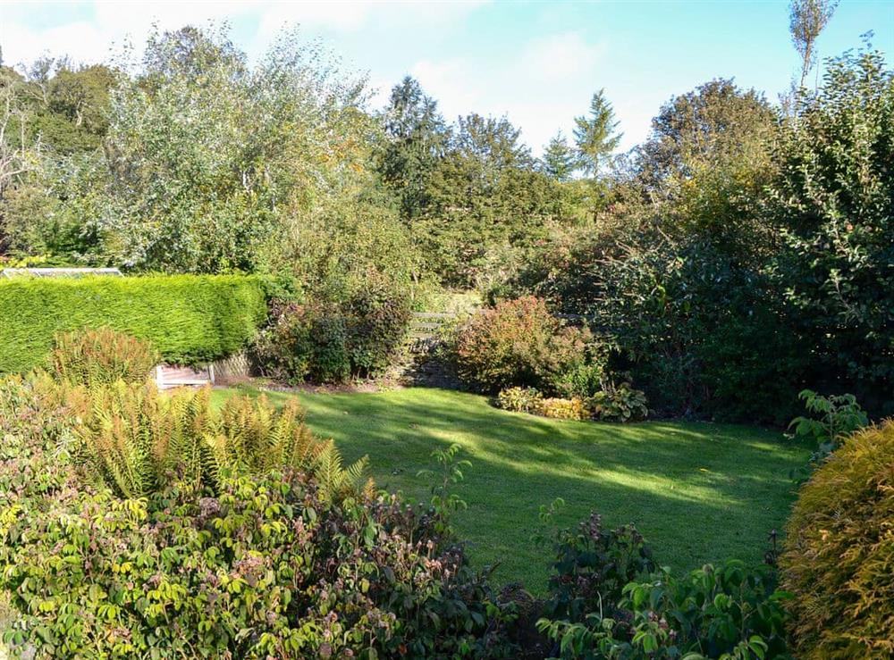 Spacious garden at the rear (photo 2) at Smithy House in Guthrie, near Forfar, Angus