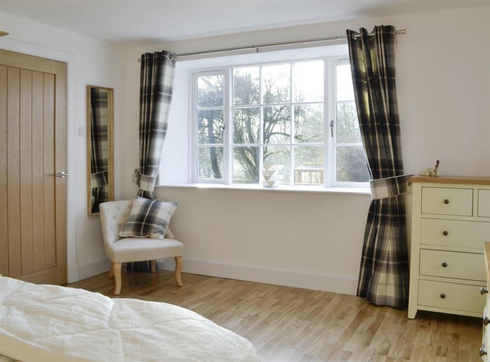Spacious master bedroom at Smithy House in Guthrie, near Forfar, Angus