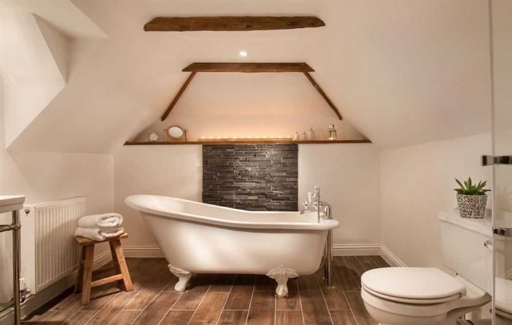En-suite bathroom with roll top bath and separate shower at Smithycroft, Combe St Nicholas