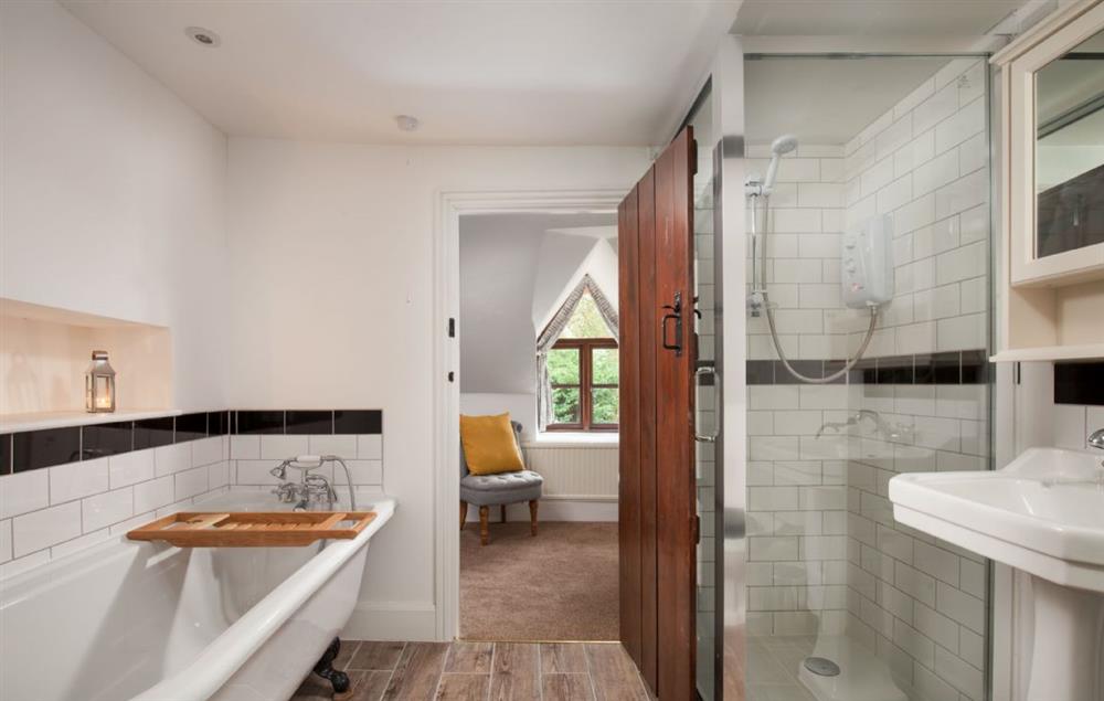 Family bathroom with roll-top bath and separate shower at Smithycroft, Combe St Nicholas