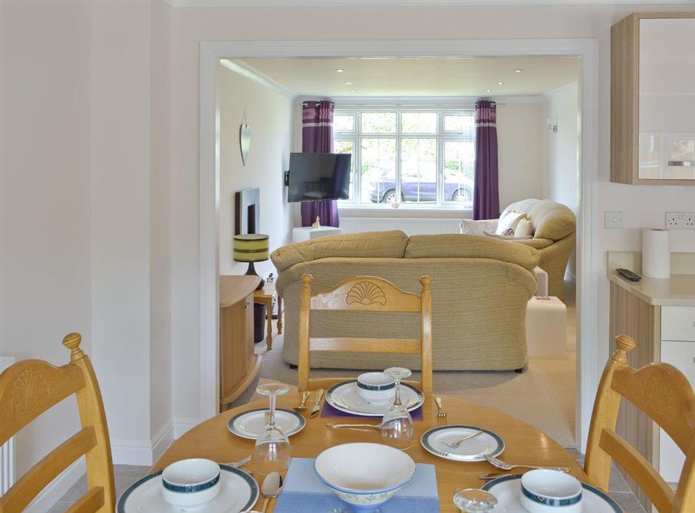 Light and airy dining space in large kitchen at Smitten Cottage in Rhyl, Denbighshire