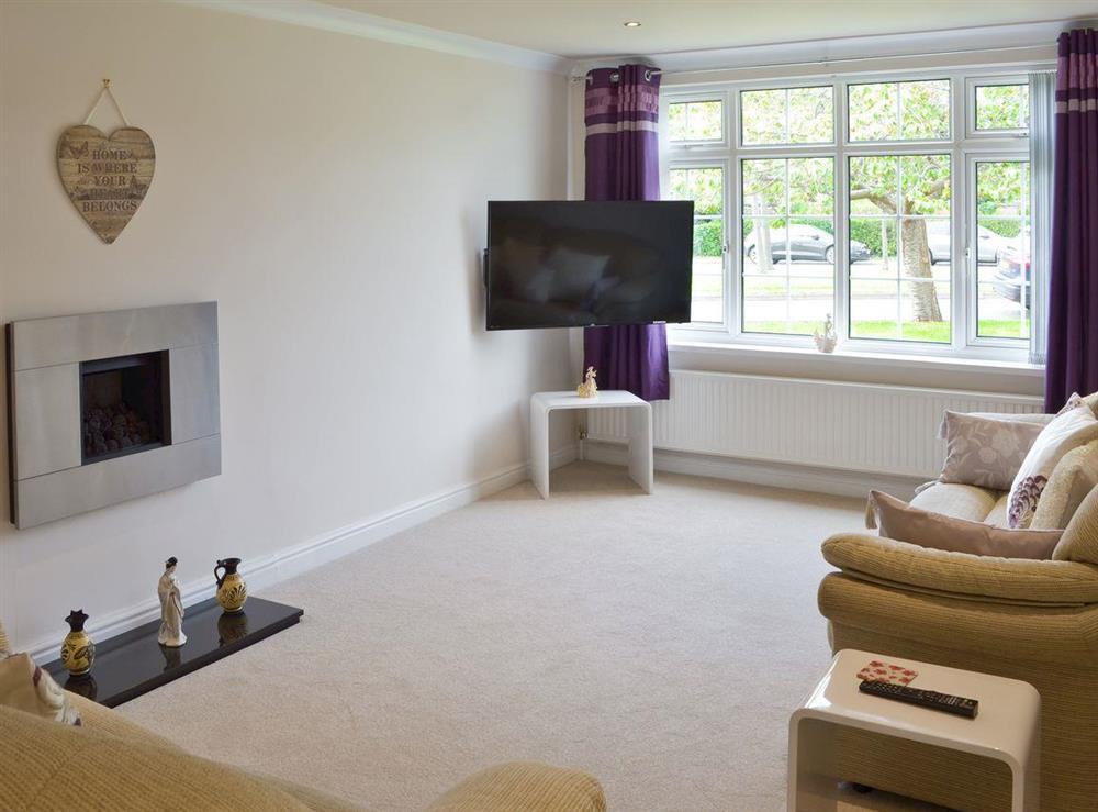 Spacious lounge area at Smitten Cottage in Rhyl, Denbighshire