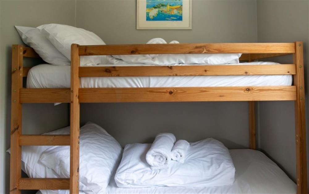 The bunk beds in the third bedroom are child size. at Smugglers in Helford Passage