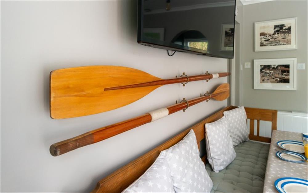 These oars are an interesting wall feature, perfect for this "boaty" themed apartment.  at Smugglers in Helford Passage