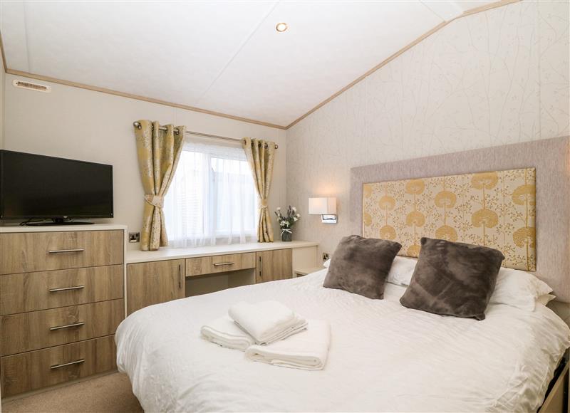 A bedroom in Snape Lodge at Snape Lodge, Towyn