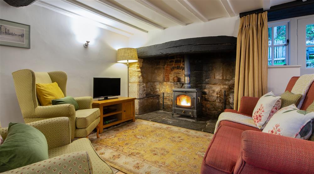 The living and dining area at Snowshill Honor's Cottage in Broadway, Gloucestershire