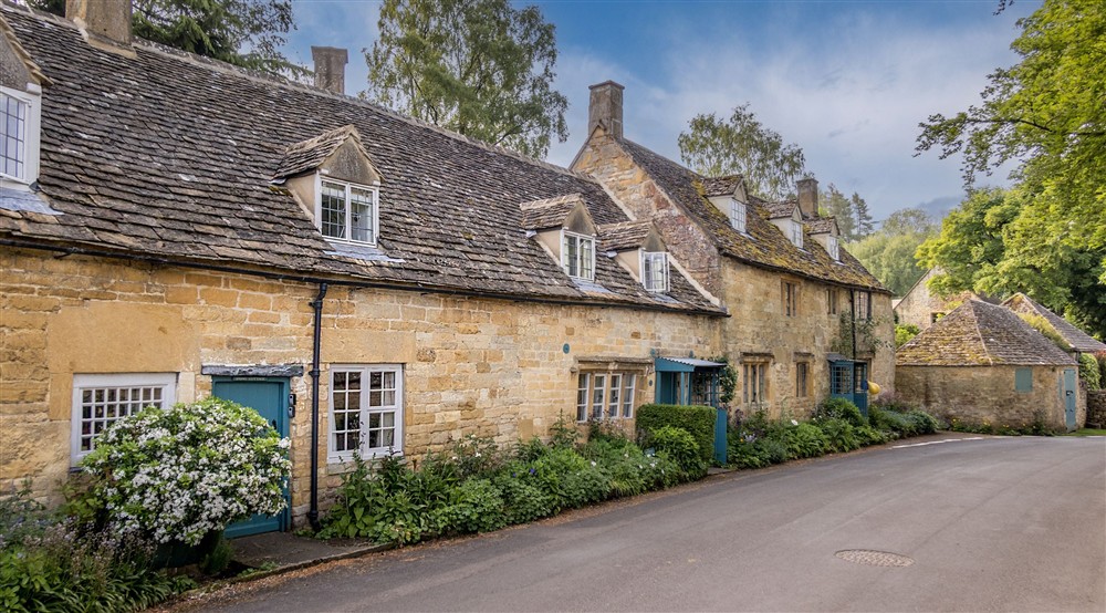 Looking along the village street at Snowshill Manor Farmhouse in Broadway, Gloucestershire