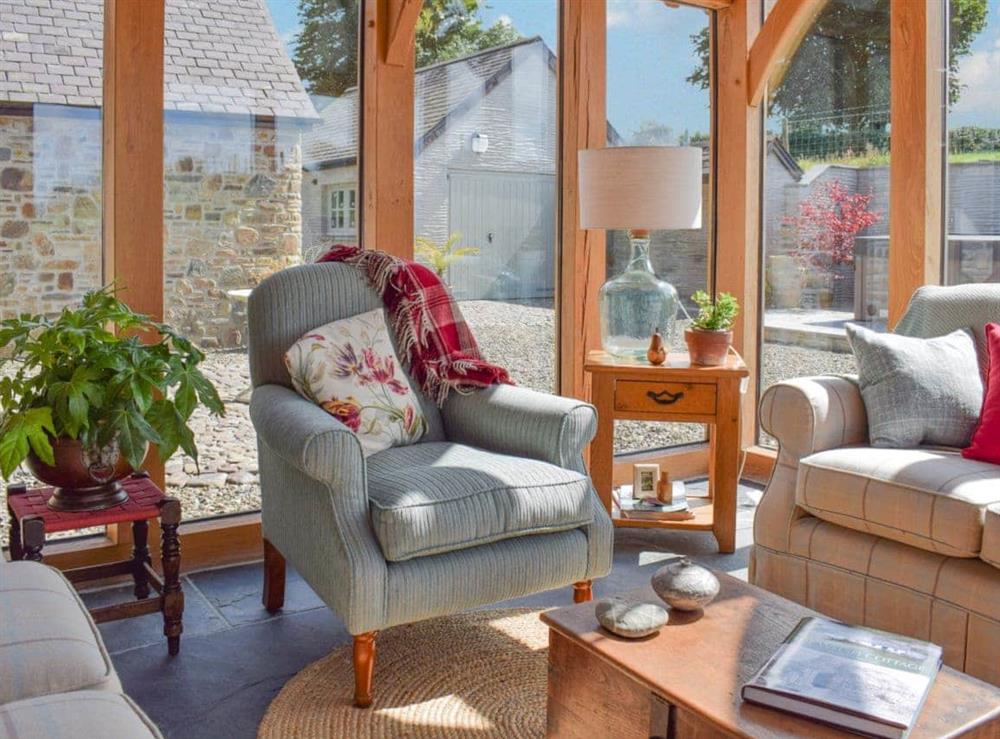Comfortable and airy sun room at Soar Cottage in Dihewyd, near Aberaeron, Ceredigion, Dyfed
