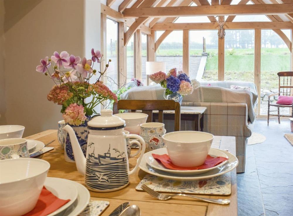 Dining area and adjacent sun room at Soar Cottage in Dihewyd, near Aberaeron, Ceredigion, Dyfed
