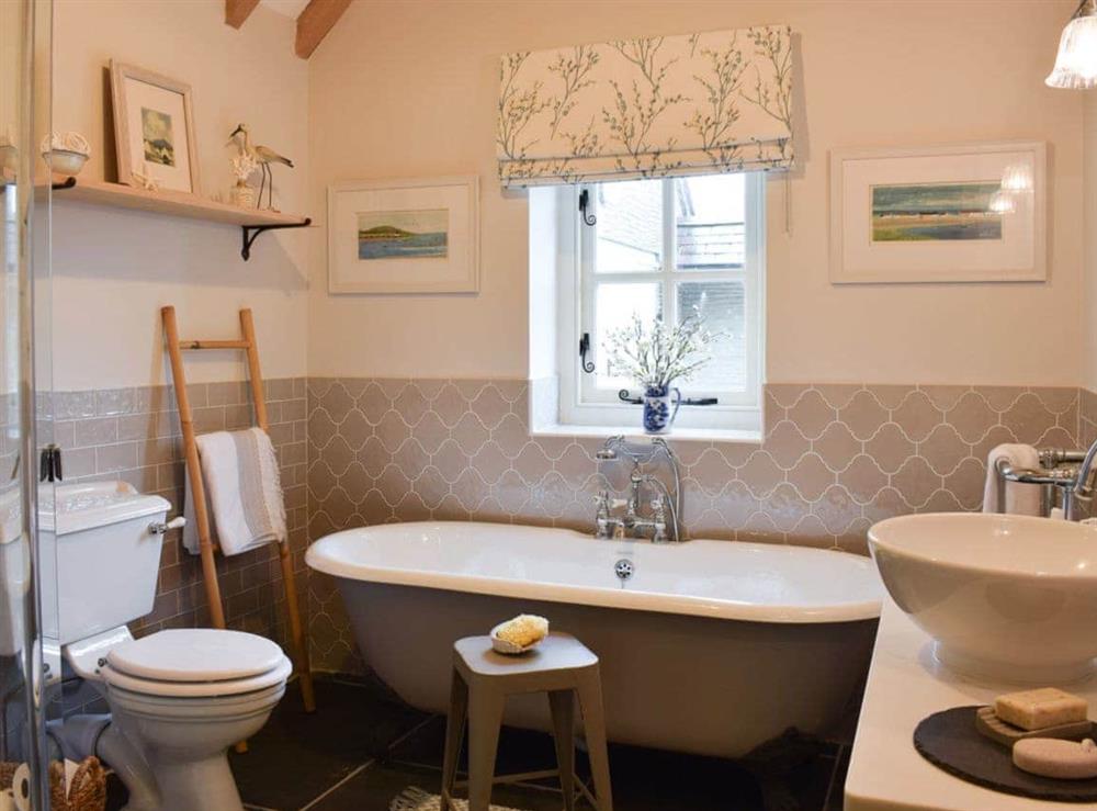 Romantic standalone roll top bath in the bathroom at Soar Cottage in Dihewyd, near Aberaeron, Ceredigion, Dyfed