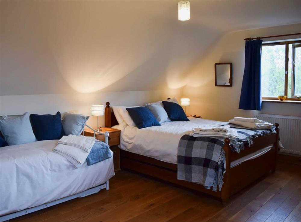 Bedroom with kingsize bed and day bed at Solitude in Aberhafesp, near Newtown, Powys