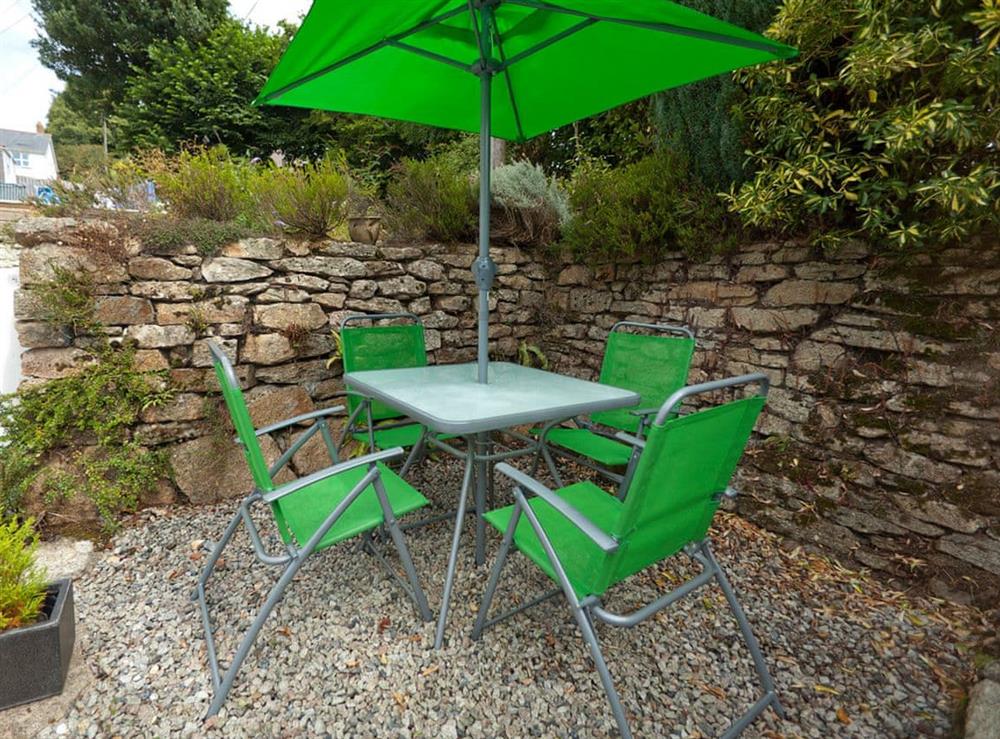 Raised patio area with outdoor furniture at Sorgente in Falmouth, Cornwall