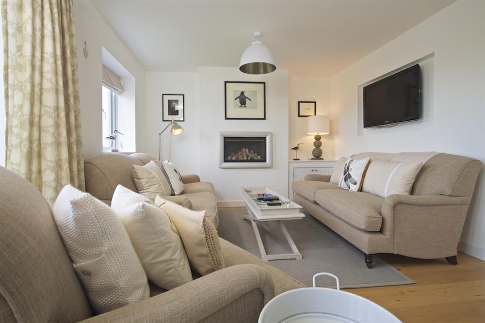 Soundings in Salcombe and its elegantly furnished sitting room with two double sofas