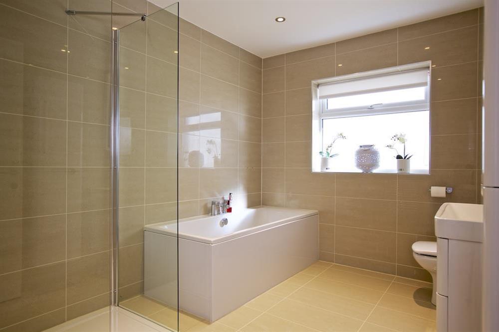 Spacious, fully tiled family bathroom at Soundings in , Salcombe