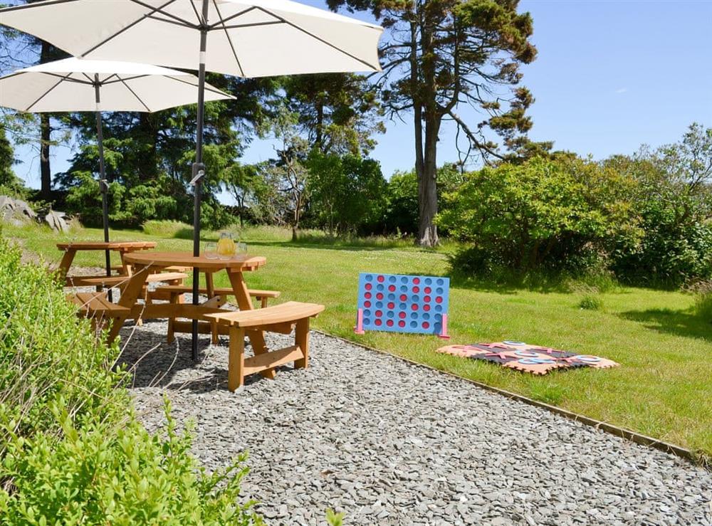 Gravelled patio area with outdoor furniture at Souterstead in Torver, near Coniston, Cumbria