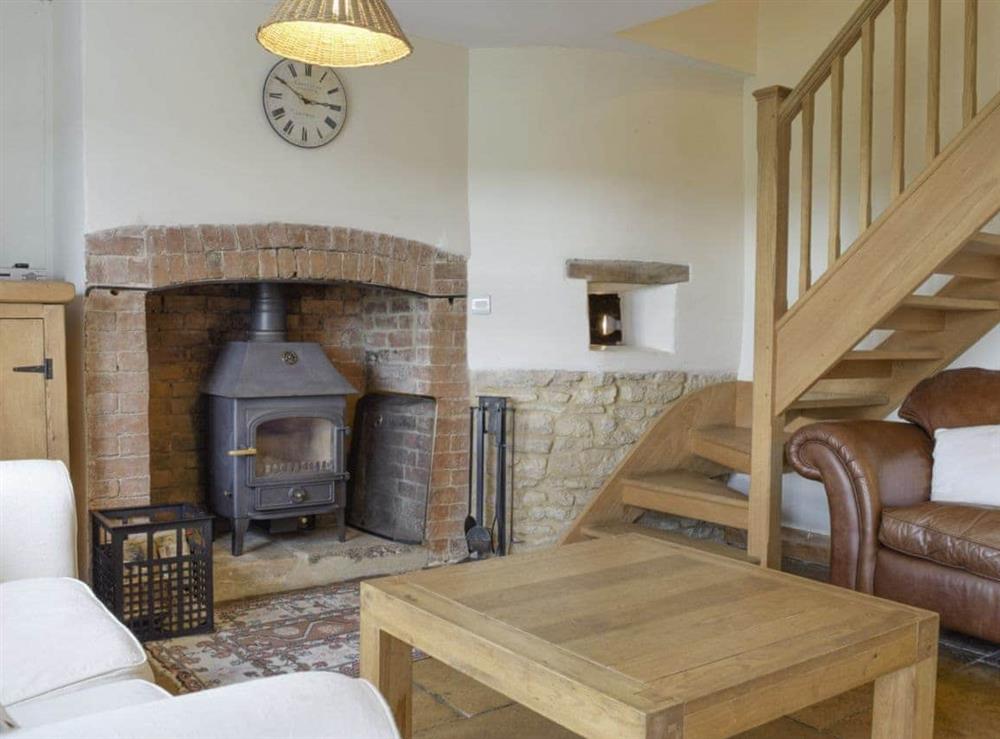 Cosy living area packed with heritage features at South View Cottage in Dean, near Chadlington, Oxfordshire