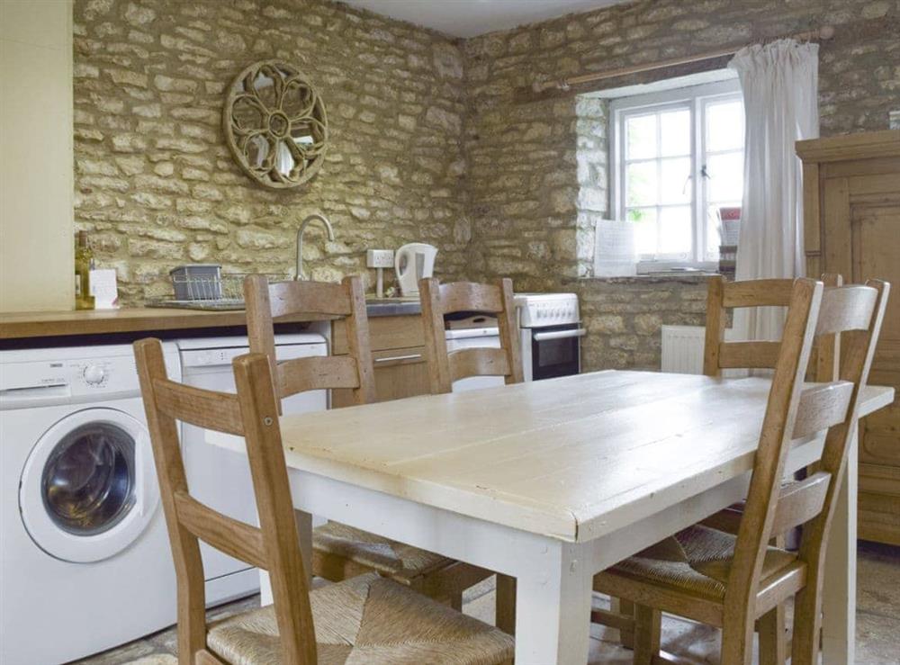 Dining area within kitchen space at South View Cottage in Dean, near Chadlington, Oxfordshire
