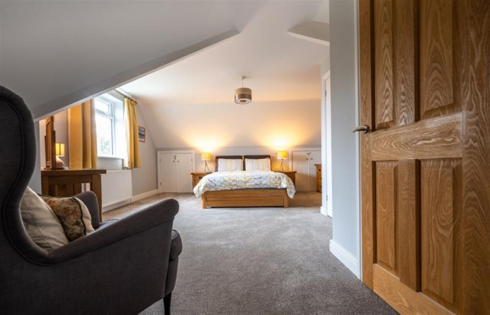 Master bedroom with king-size bed at South View, West Runton near Cromer