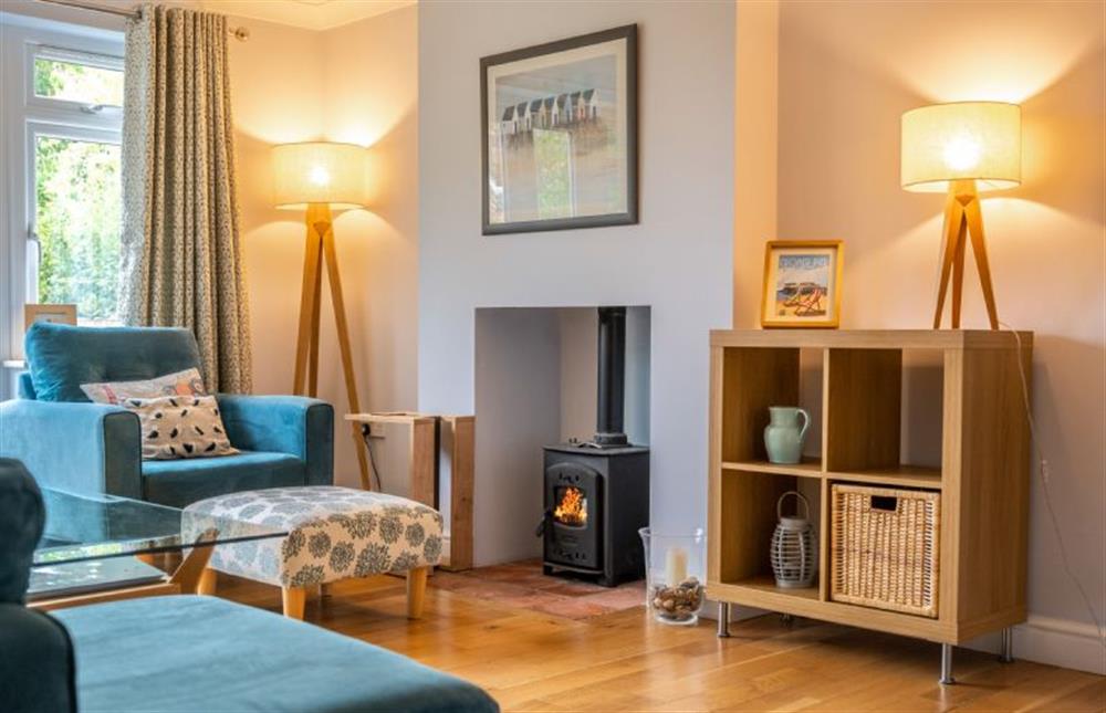 Spacious sitting room with a cosy wood burning stove at South View, West Runton near Cromer