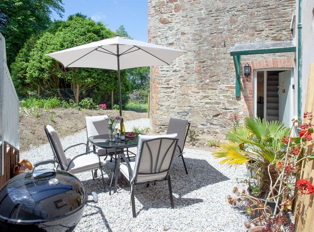 Patio at South Wing Cottage in Rumleigh, Devon