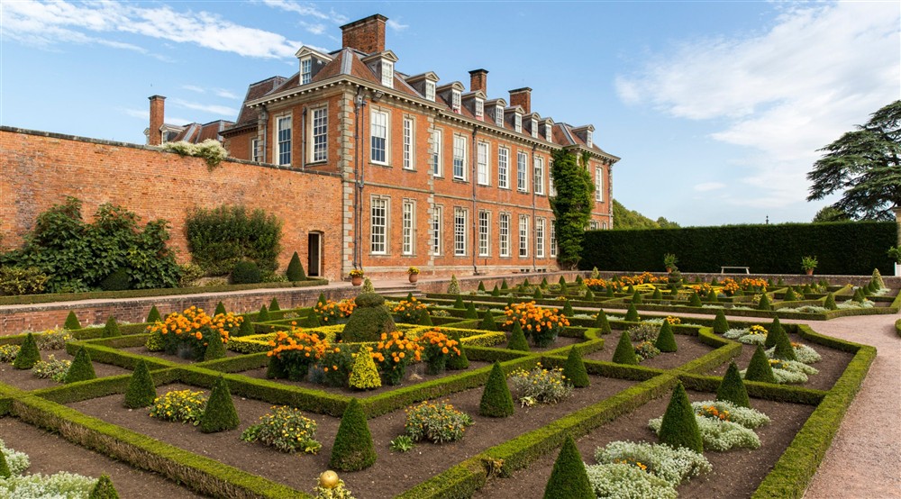 A view of the house and parterre garden at South Wing in Droitwich, Worcestershire