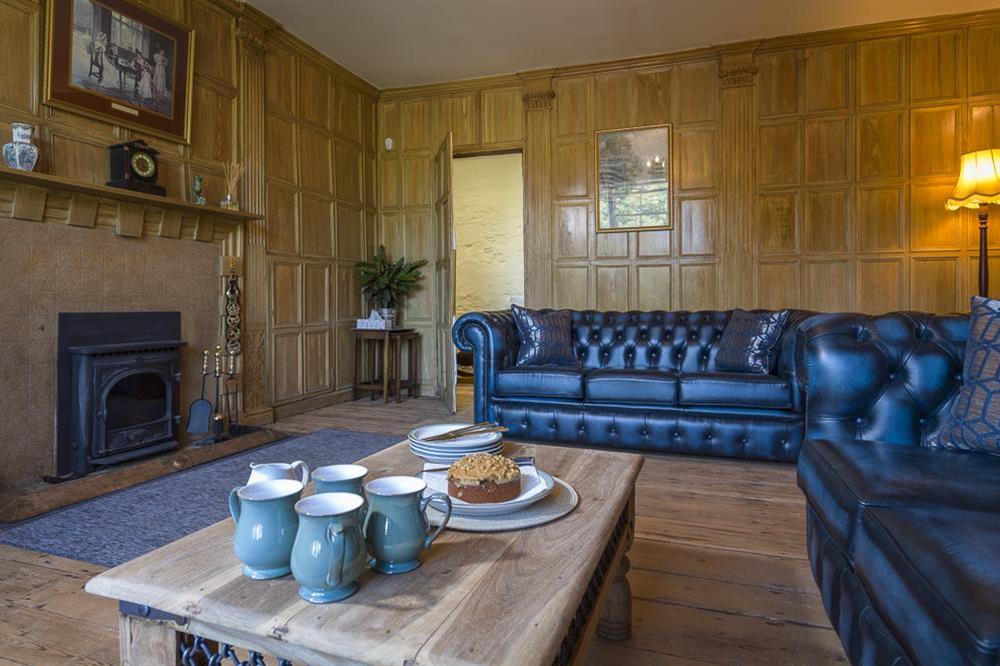 Cosy sitting room with restored oak panelling and Chesterfield sofas (photo 2) at South Wing in , Nr Kingsbridge