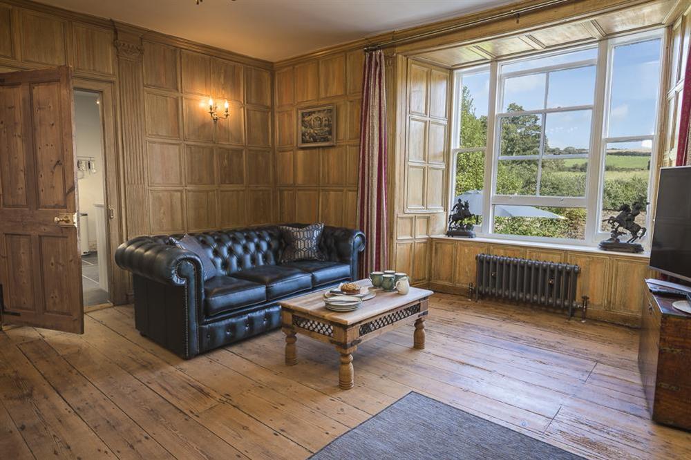 Cosy sitting room with restored oak panelling and Chesterfield sofas (photo 3) at South Wing in , Nr Kingsbridge