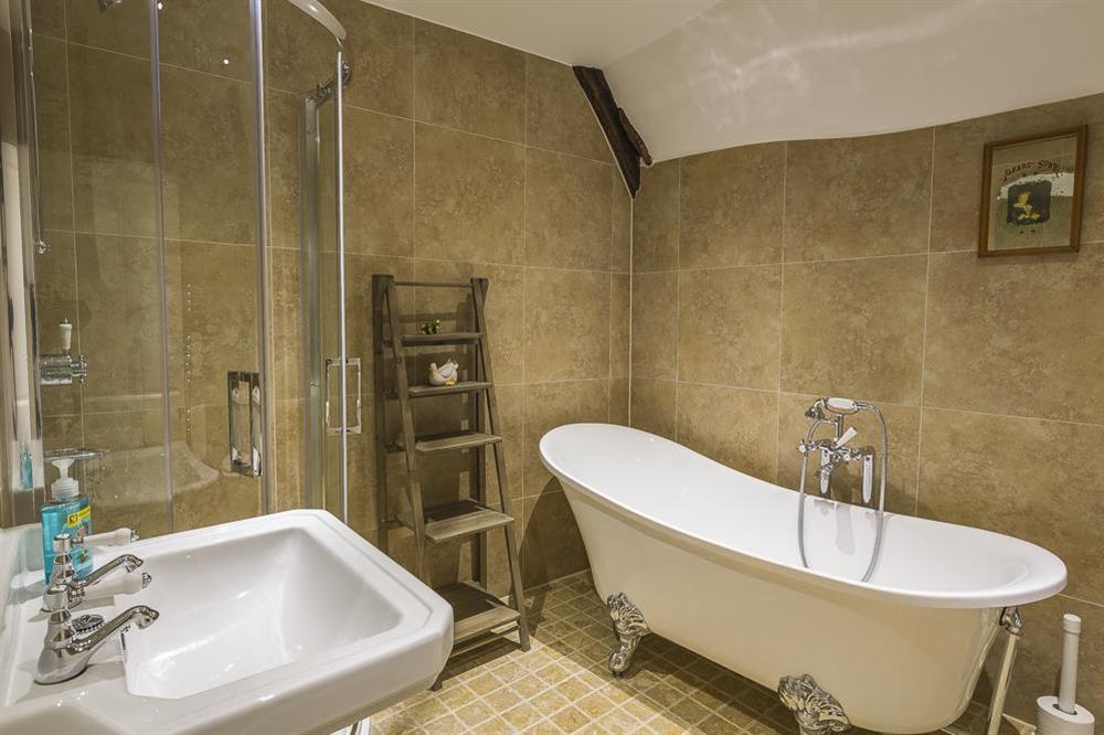 Fully tiled family bathroom with freestanding slipper bath and separate shower at South Wing in , Nr Kingsbridge